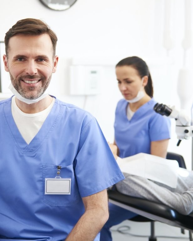portrait-of-smiling-male-dentist-in-dentist-s-clinic.jpg